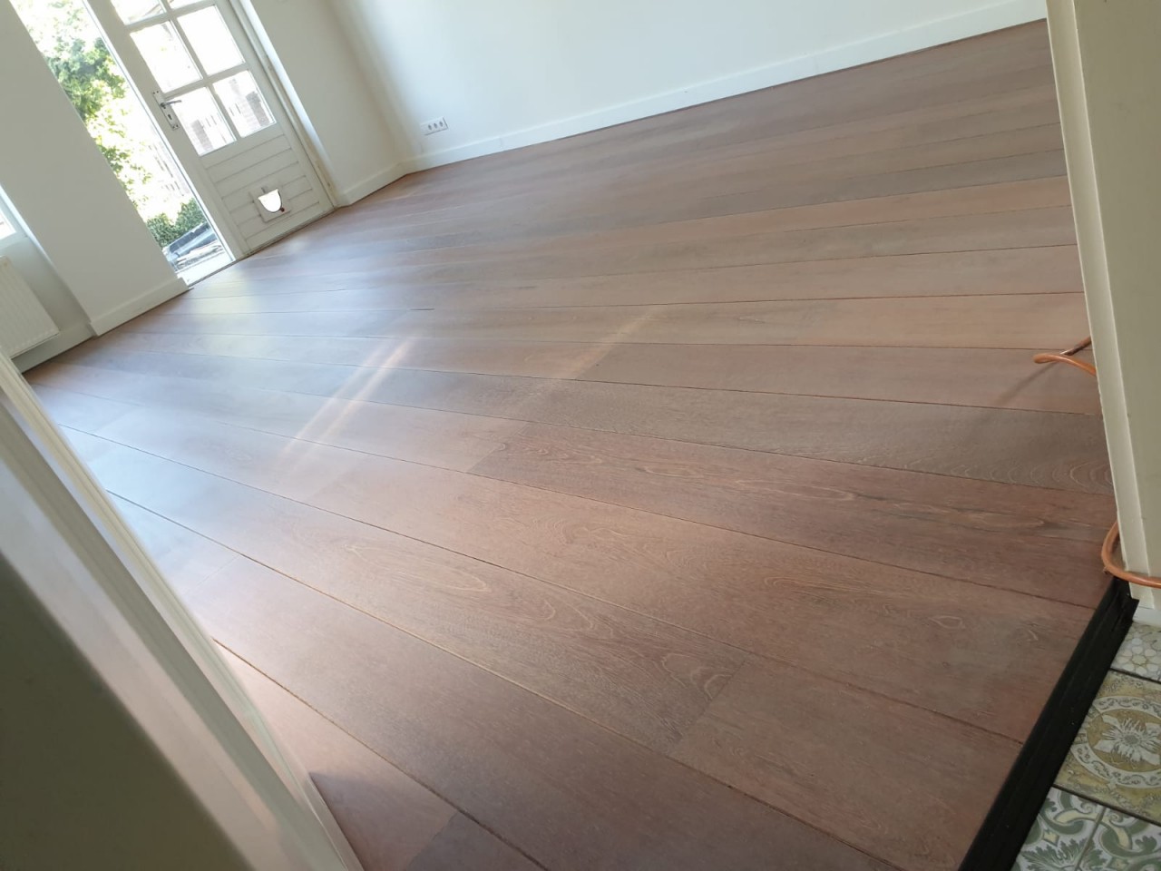 Merbau vloer behandelen